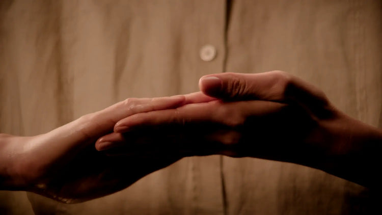 The practitioner’s hands preparing a spa treatment.