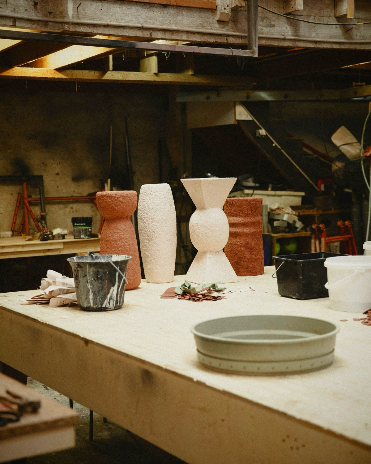 Papier-mâché plinths in the workshop.